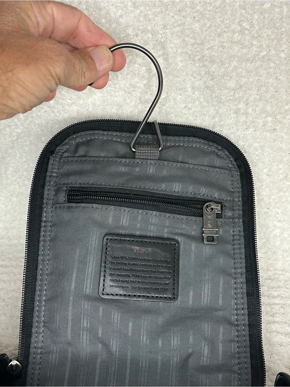 Tumi Black Toiletry Bag with Red Accents